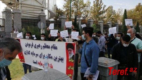 İranda fond birjasının qurbanları parlament qarşısında etiraza qalxdı
