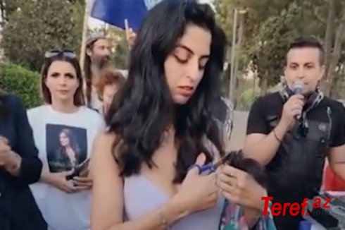İsraildə etirazçılar İran qadınlarına dəstək olaraq saçlarını kəsdilər - VİDEO